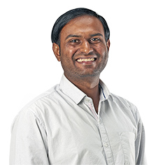 a man smiling at the camera